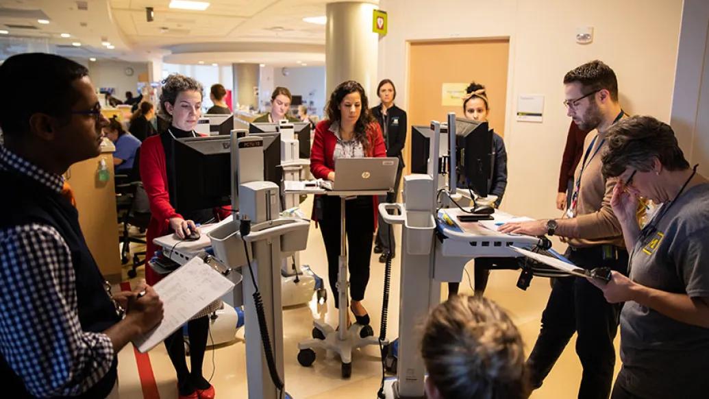 Pediatric heart care team rounding in cardiac critical care unit