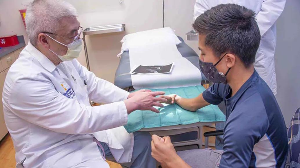 Pediatric hand specialist with patient