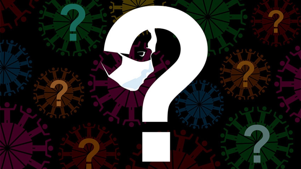white big question mark with mask hanging off in black background with colored question marks floating