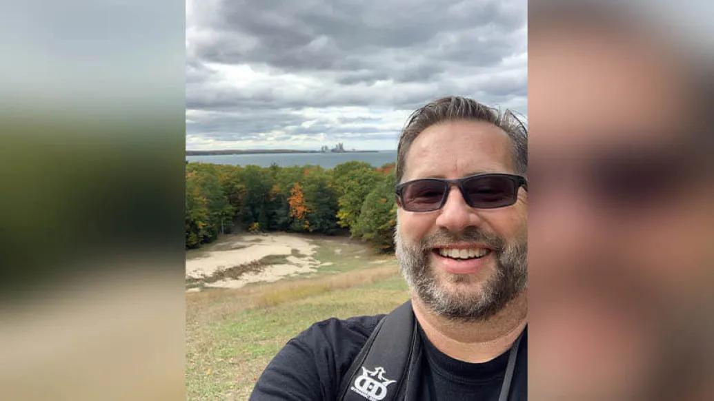 Scott Weston overlooking a lake