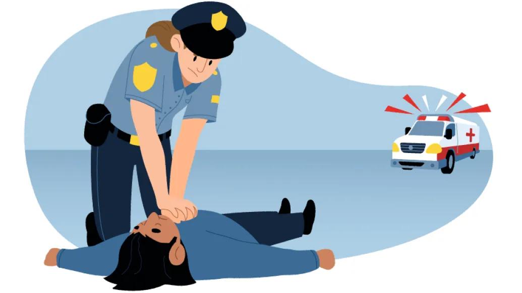 Police officer in uniform performing CPR to person lying on ground. Ambulance in  background.