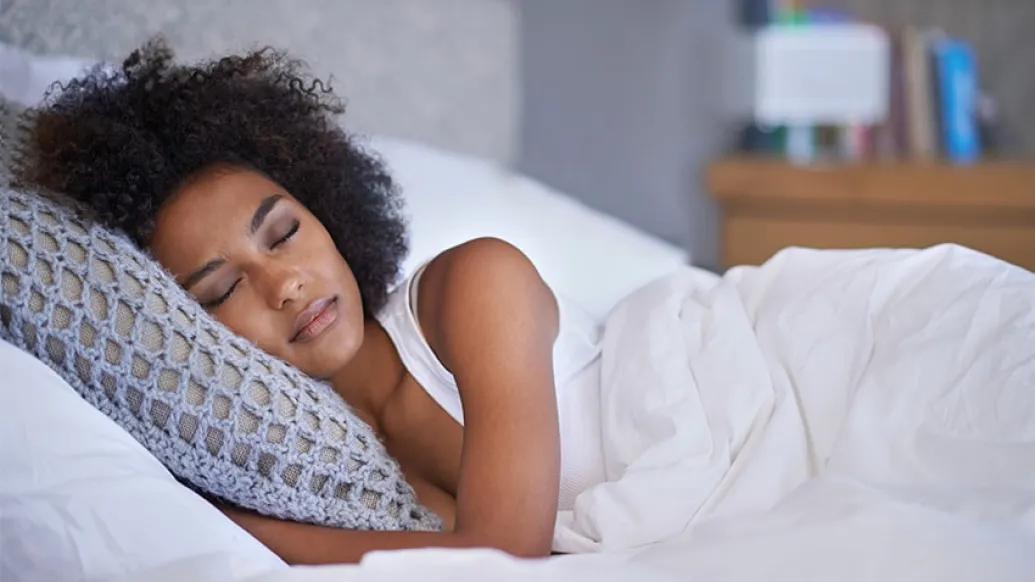 A woman taking a sleep apnea test at home