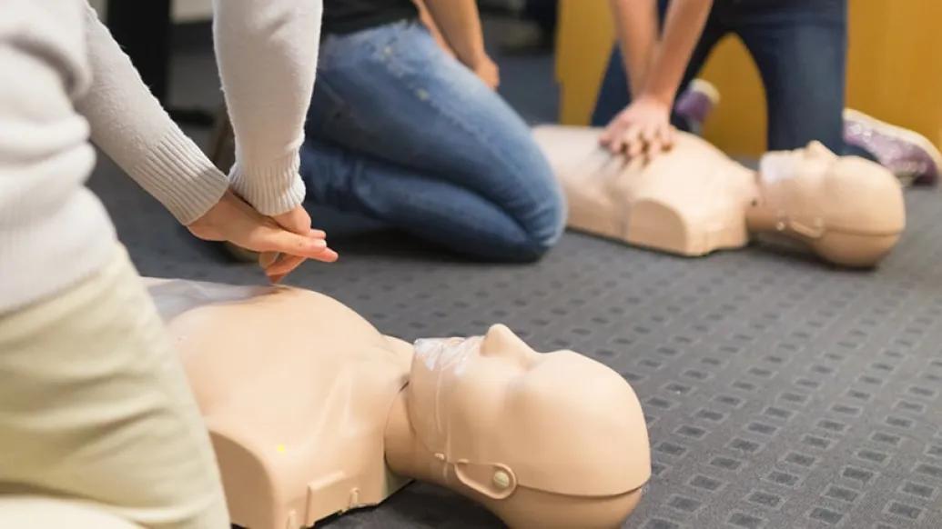 Students learning how to perform CPR