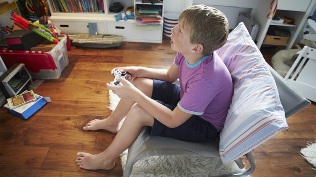 A young boy playing video games