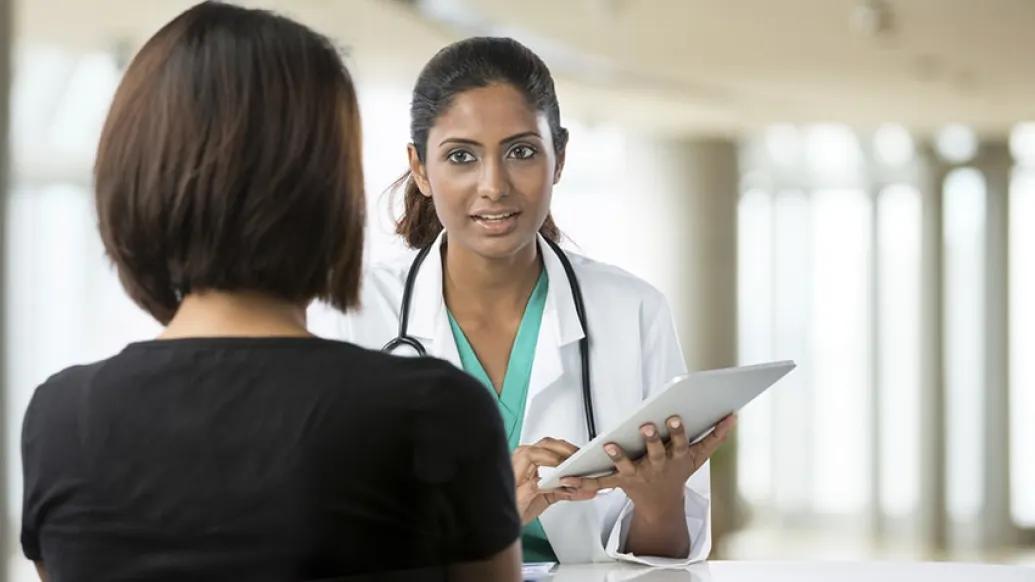 Oncologist and primary care physician working together on cancer treatment