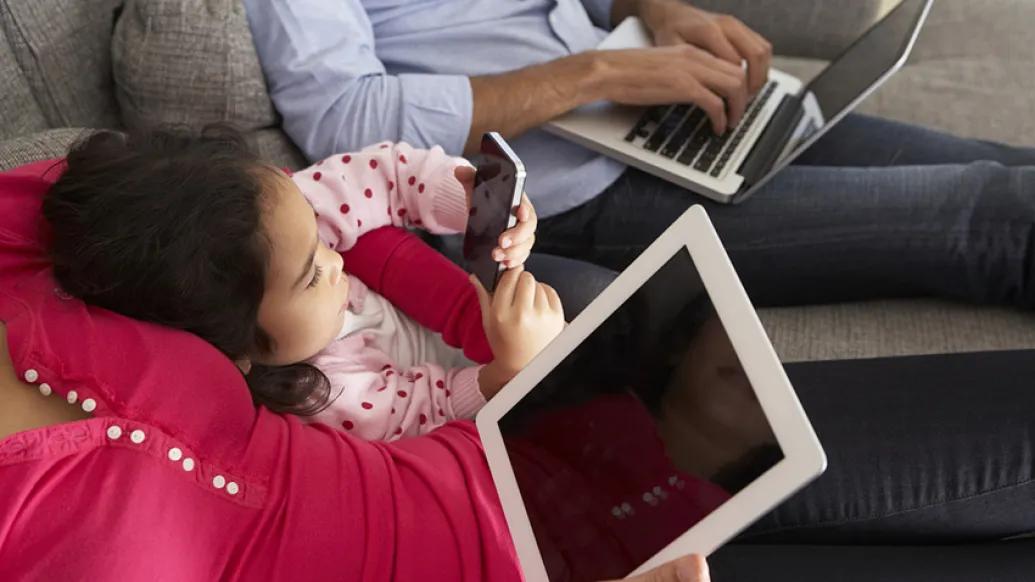 A family on their digital devices