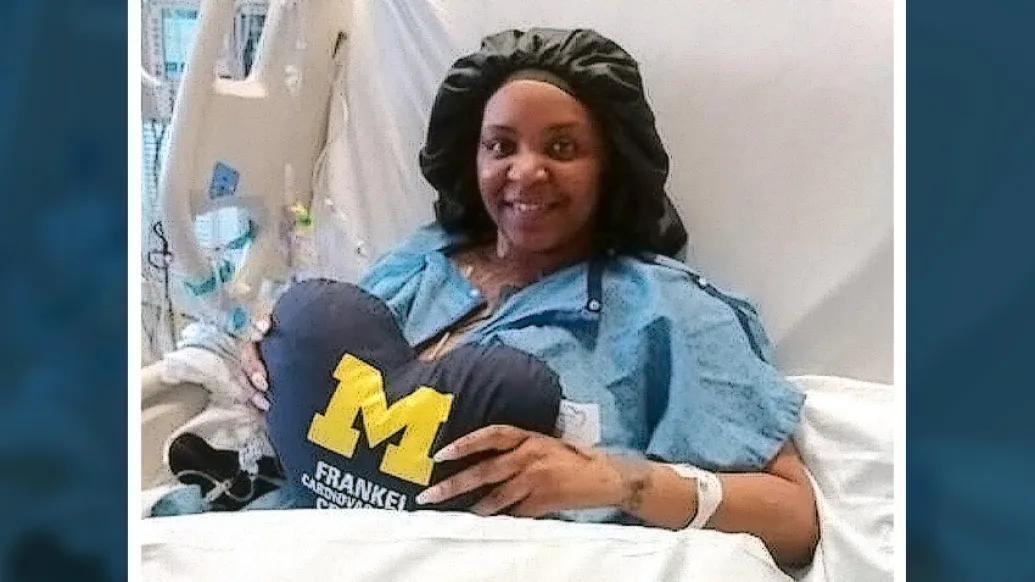 woman smiling hospital bed UM pillow
