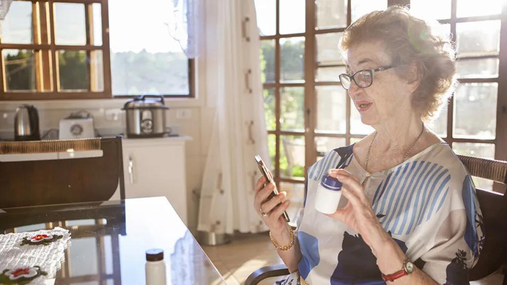 woman on phone call with prescription 
