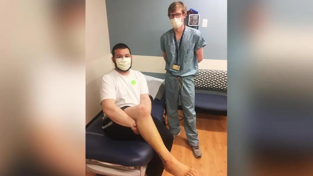 patient and doctor posing for photo
