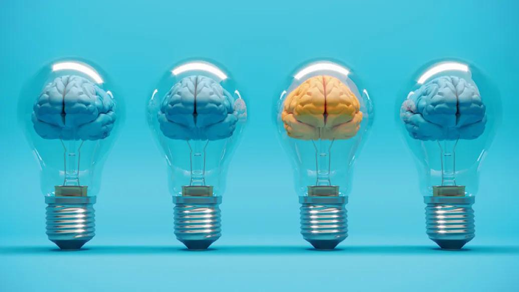 brains in blue in lightbulbs and one orange