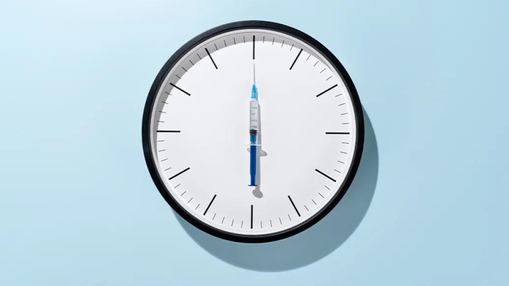clock with vaccine as clock hand