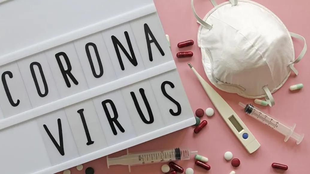 Coronavirus sign with pills and face mask