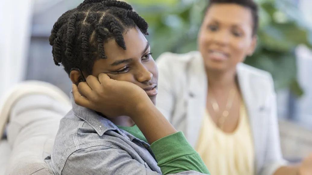 Depressed male teen with mother