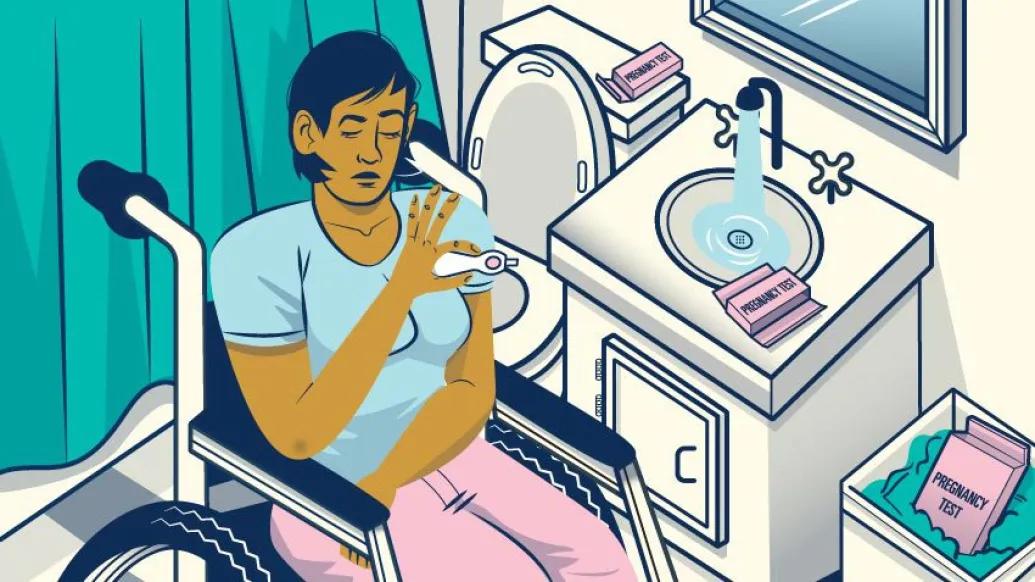 women in wheelchair looking at pregnancy test in bathroom with teal and pink and off-white muted colors