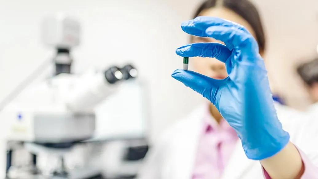 doctor with pill in hand