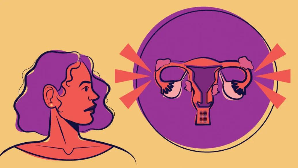 Women with purple hair looking at image of uterus