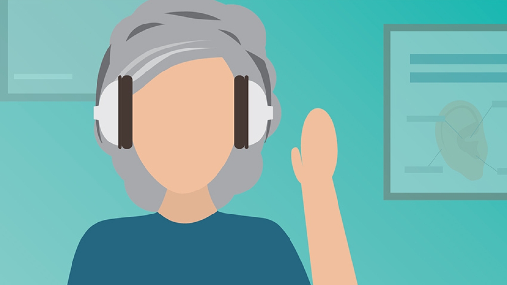 woman with grey hair with headphones on 