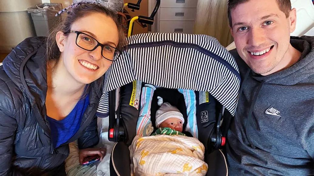 husband and wife with newborn