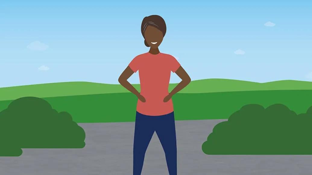woman standing with hands on hips in front of green grass and blue sky