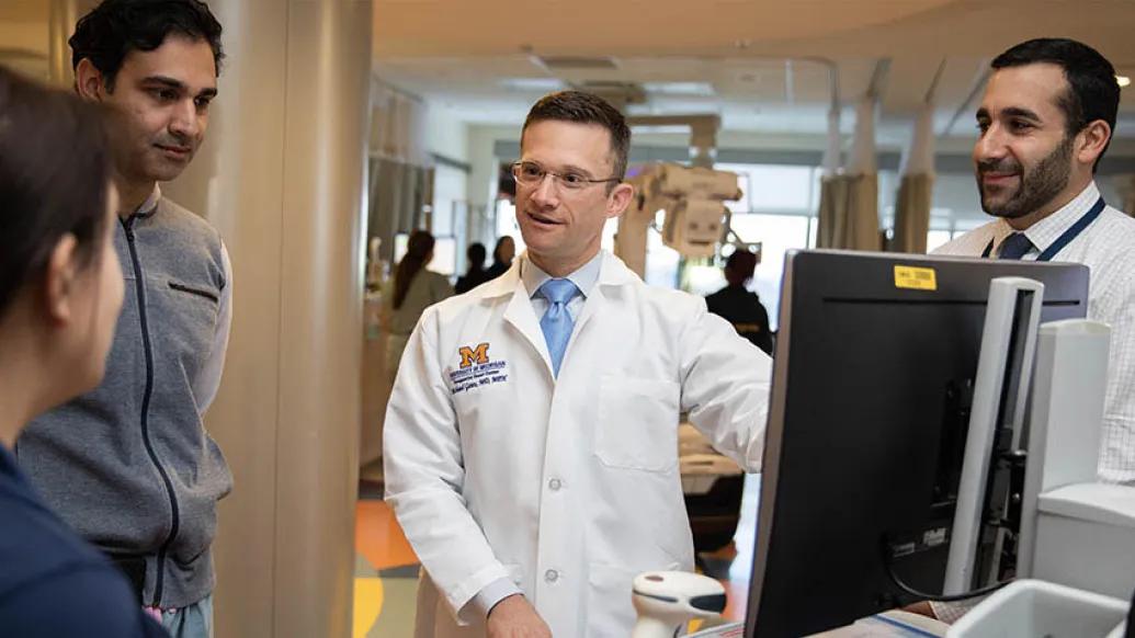 Doctor speaking with colleagues image