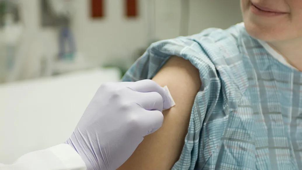 Pregnant woman receives her flu shot and Tdap vaccine during her third trimester