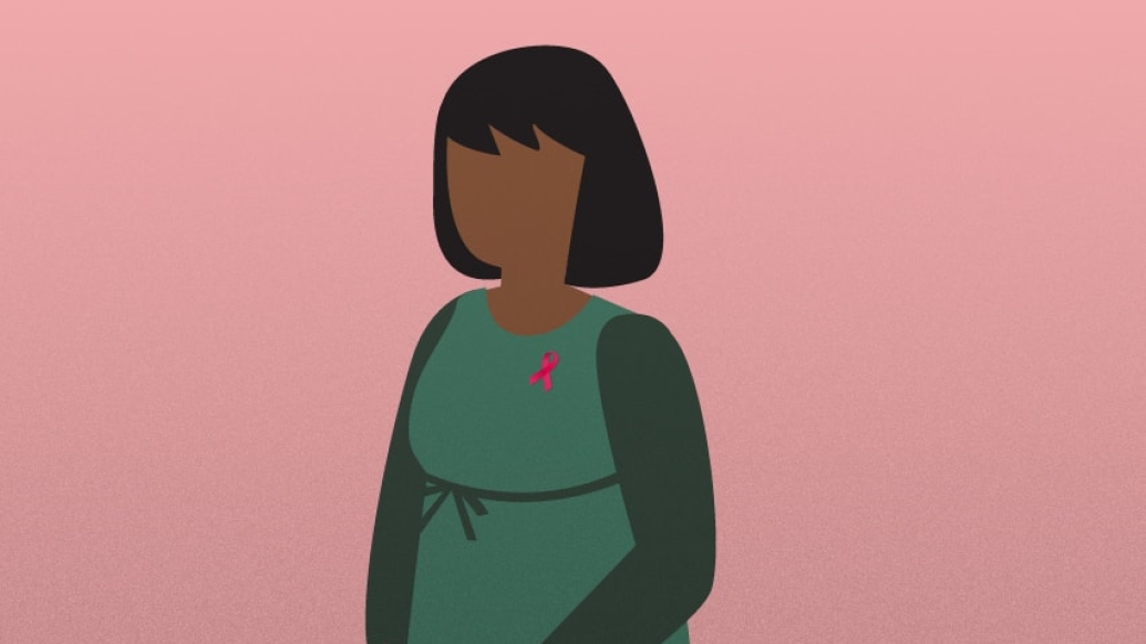 Image of woman wearing green infront of pink background wearing breast cancer pin