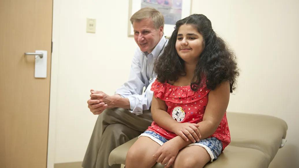 Patient sitting in doctor's office.