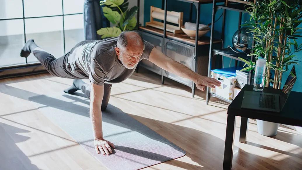 older man doing yoga low