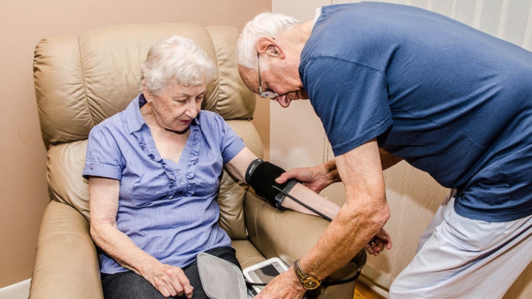 Older couple taking blood pressure