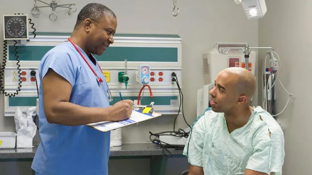 patient talking to physician in doctor's office