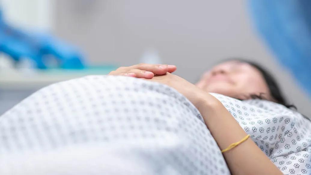 Pregnant woman on bed