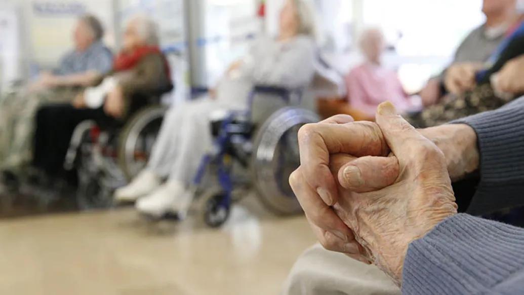 Senior hands folded in senior living