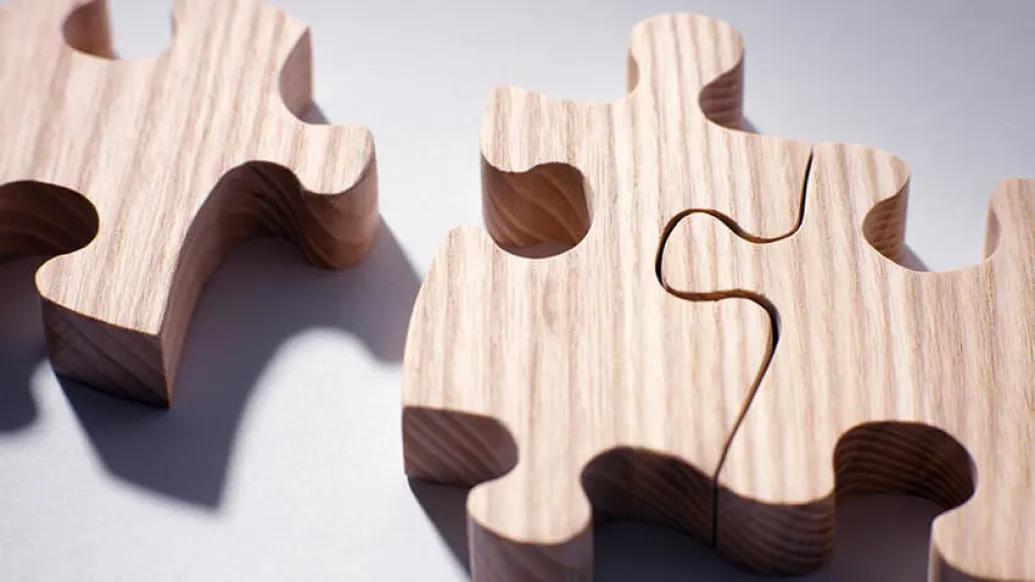 Three wooden puzzle pieces