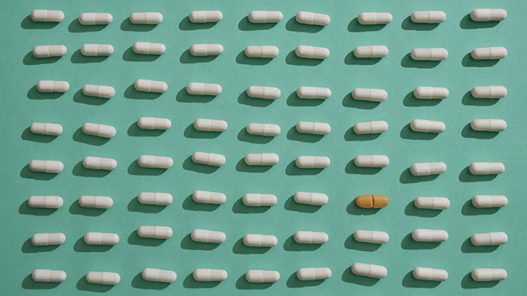 white brown pills on green background