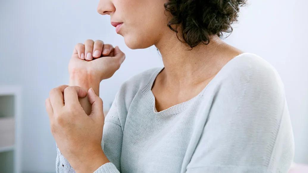 woman holding her wrist