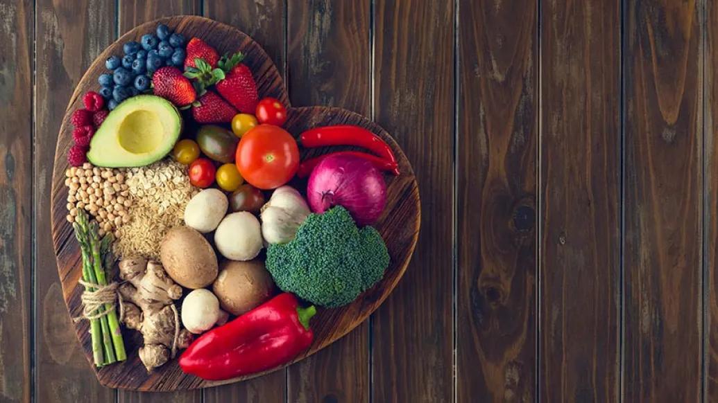 heart shaped bowl with fruits and vegetables 