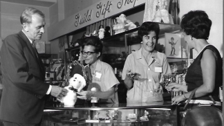 1959 photo of people at the hospital gift shop checkout counter