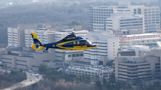 A survival flight helicopter flies near the hospital