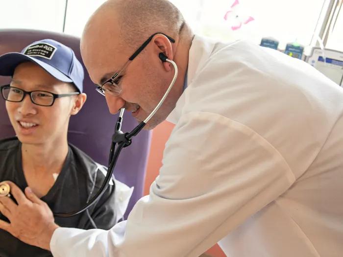 Medical professional next to patient 