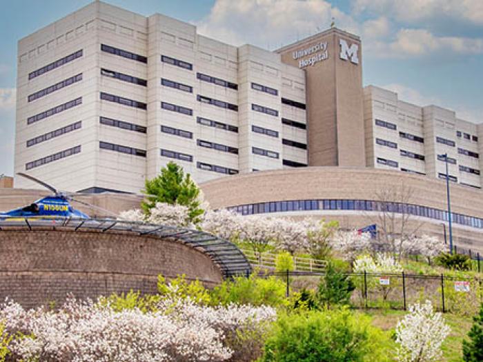 University Hospital at University of Michigan Health in the springtime with Survival flight helicopter in foreground