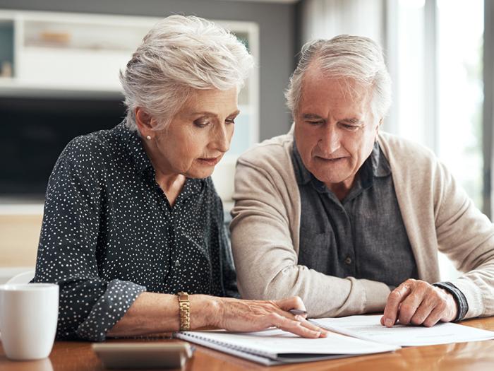 senior couple reviewing financial documents