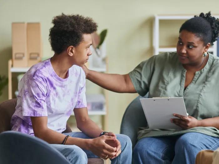 Woman supporting a teenager in need