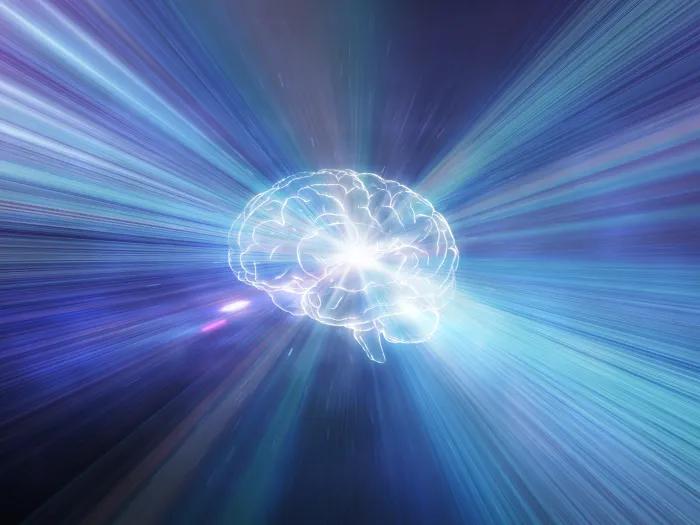 human brain with glowing purple blue lights out of brain