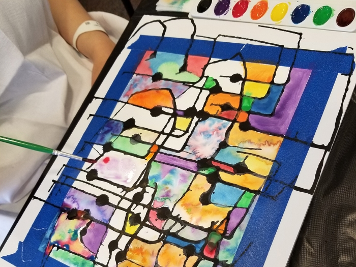 A patient makes a contemporary watercolor piece