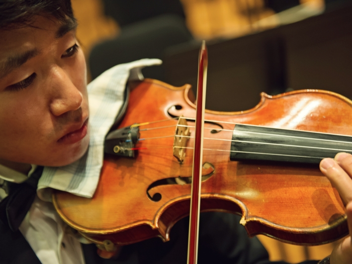 Violinist performs with the life sciences orchestra