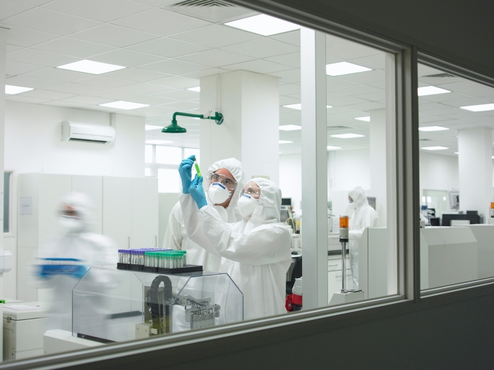 Scientists Hazmat Suits Laboratory Vials