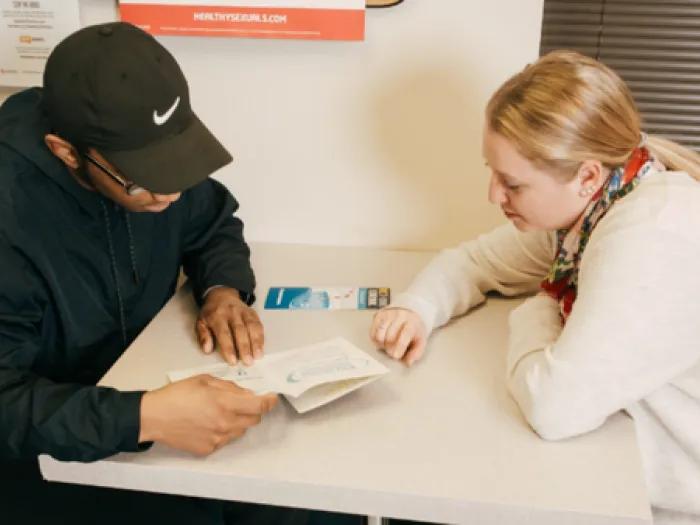 Provider and a young person engaged in conversation