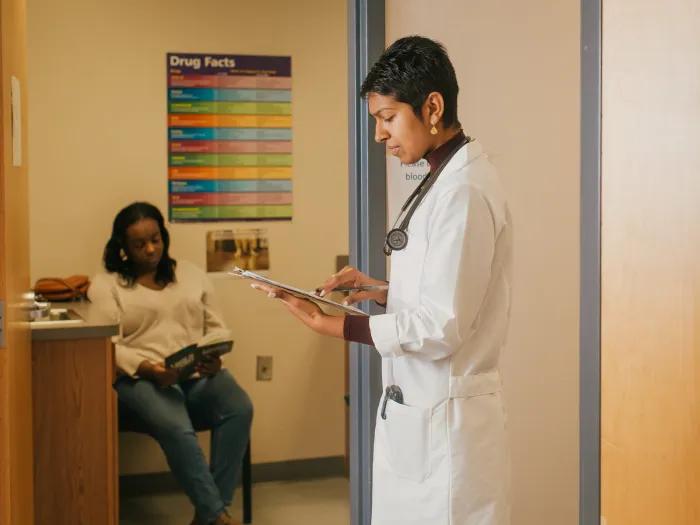Provider and a young person at a health center