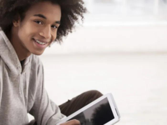 Young person holding an iPad