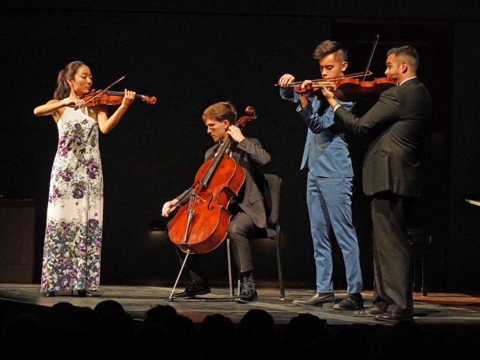 School of Music string players perform on stage